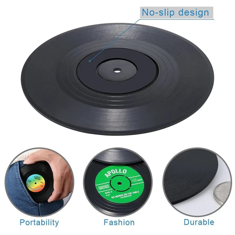 Black vinyl record with no-slip design, portability, fashion, and durability features on a white background.