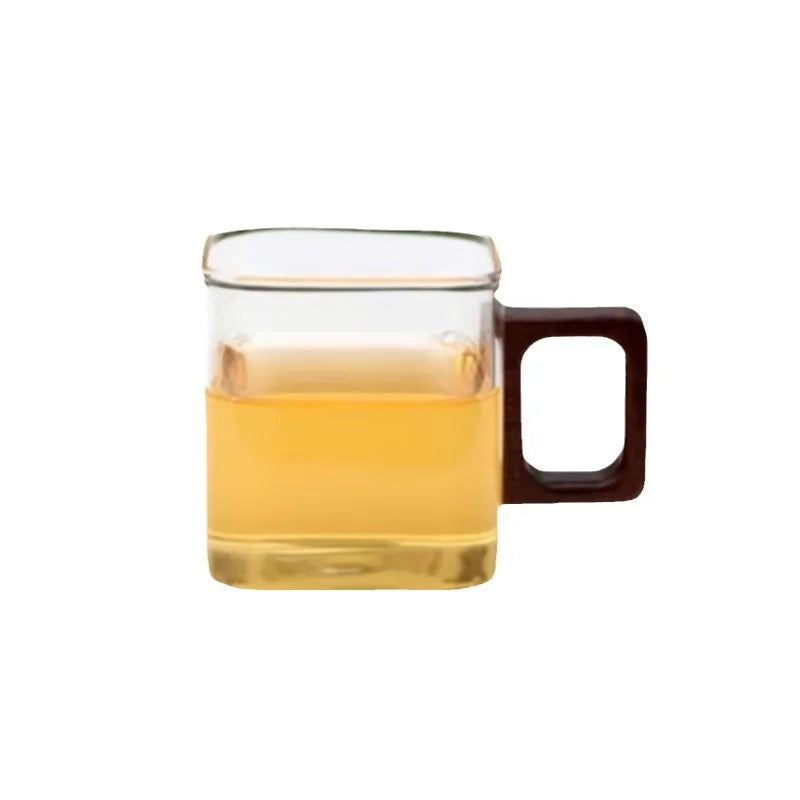A clear, isolated studio shot of the square walnut handle glass coffee mug on a crisp white background.
