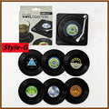 Set of vinyl record coasters with packaging on a white background