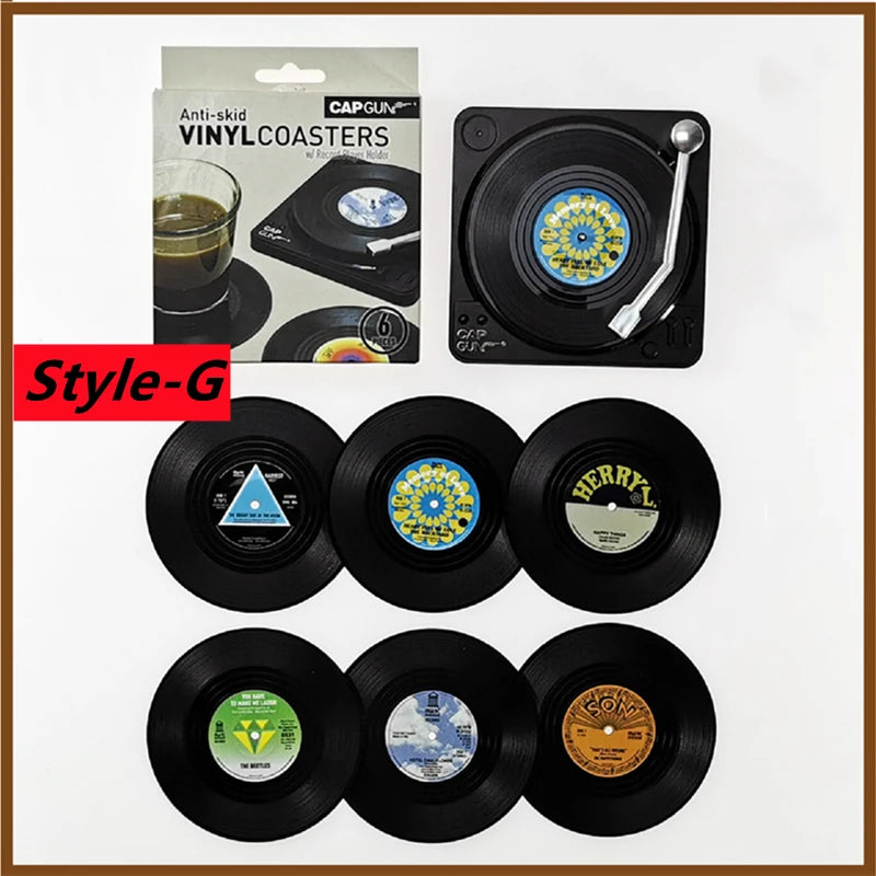 Set of vinyl record coasters with packaging on a white background