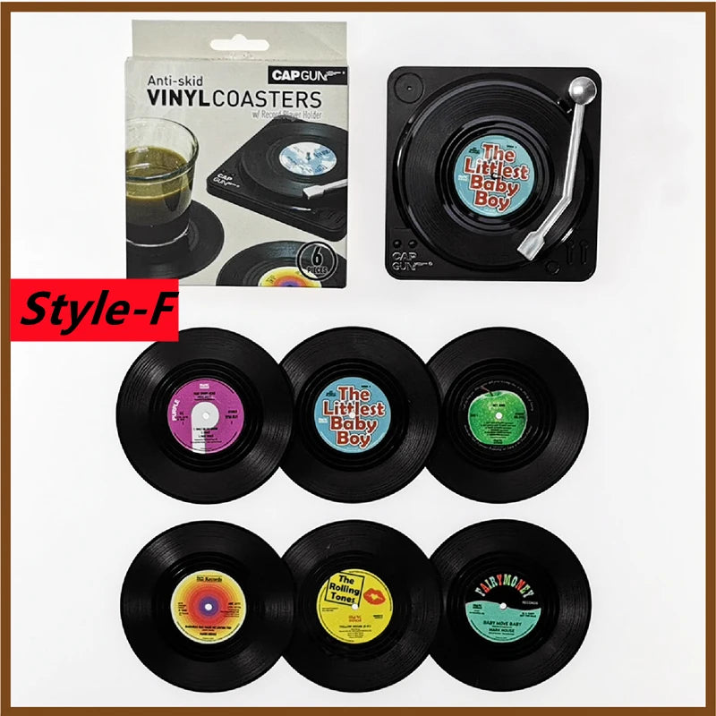 Set of vinyl record coasters with colorful labels and packaging.